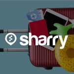 логотип і назва компанії Sharry на фоні валізи, пасторта, планшета та надувного круга